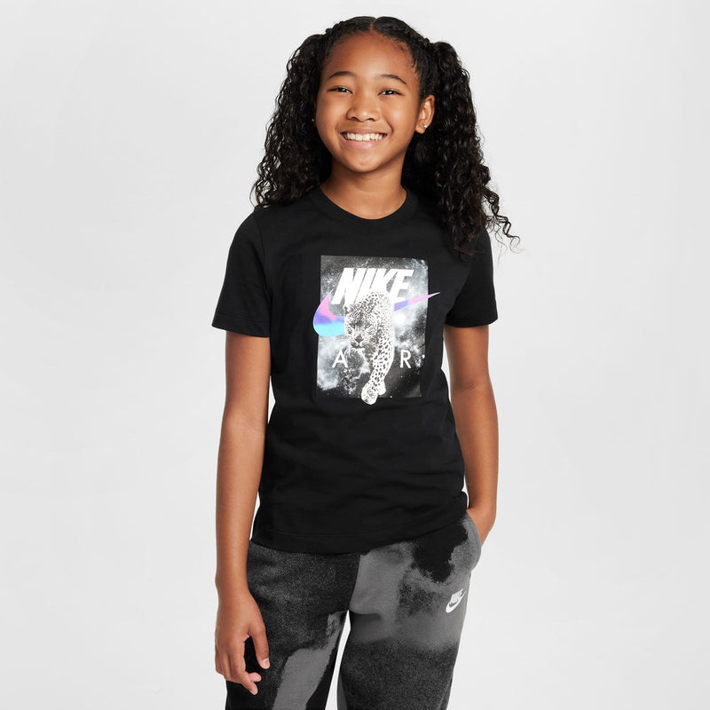 Black youth graphic T-shirt with NIKE leopard photo print and color swoosh.