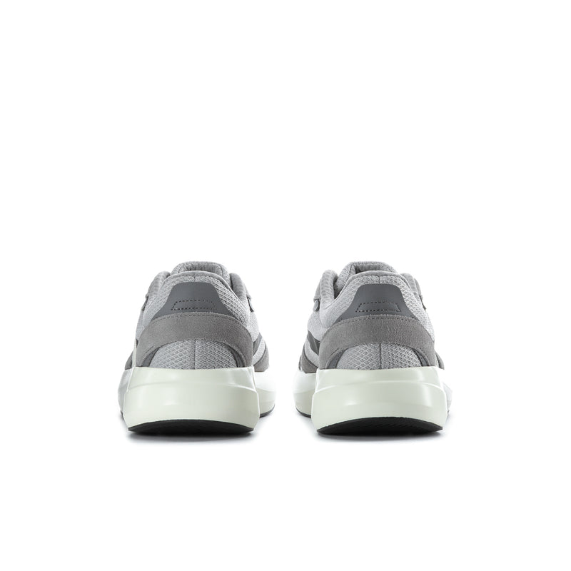 Grey sneakers with rear heel tab and white midsole, paired back view