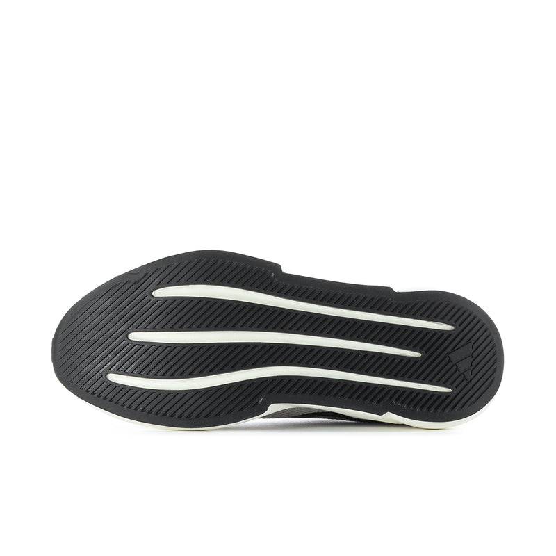 Shoe outsole with textured black tread and white accent stripes