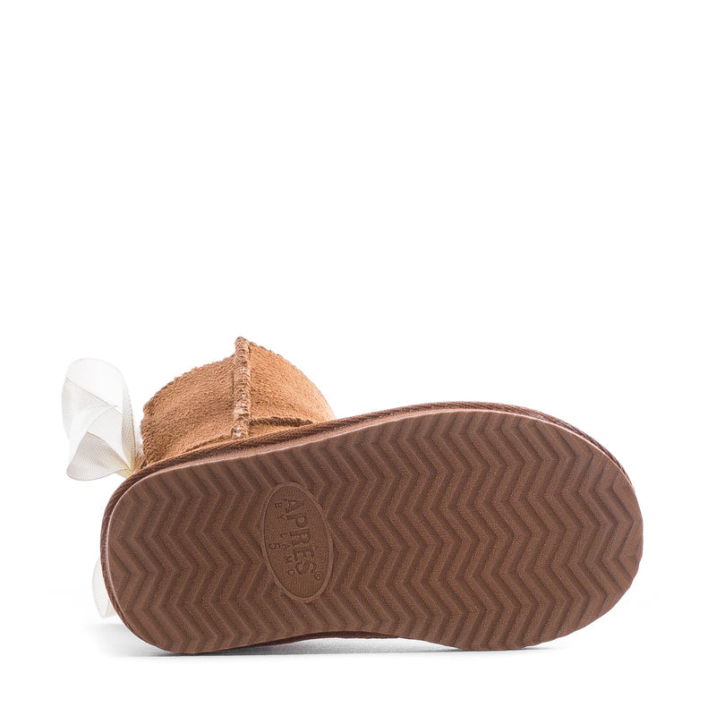 Toddler boot with white bow and textured rubber sole