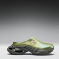 Green and gray shoe on a gradient background