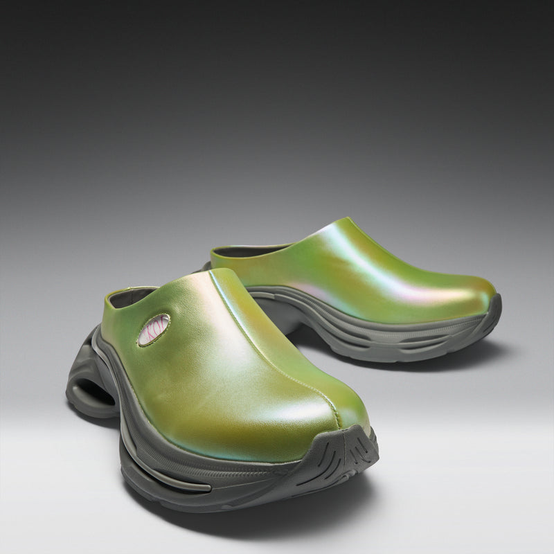 Pair of green clogs on a gray background