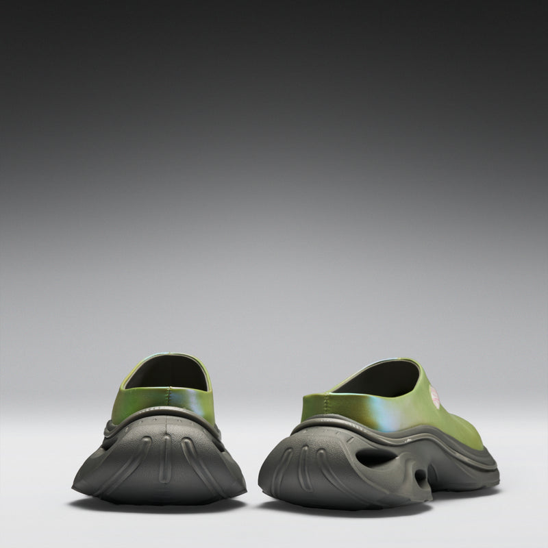 Green and black shoes on a gradient gray background
