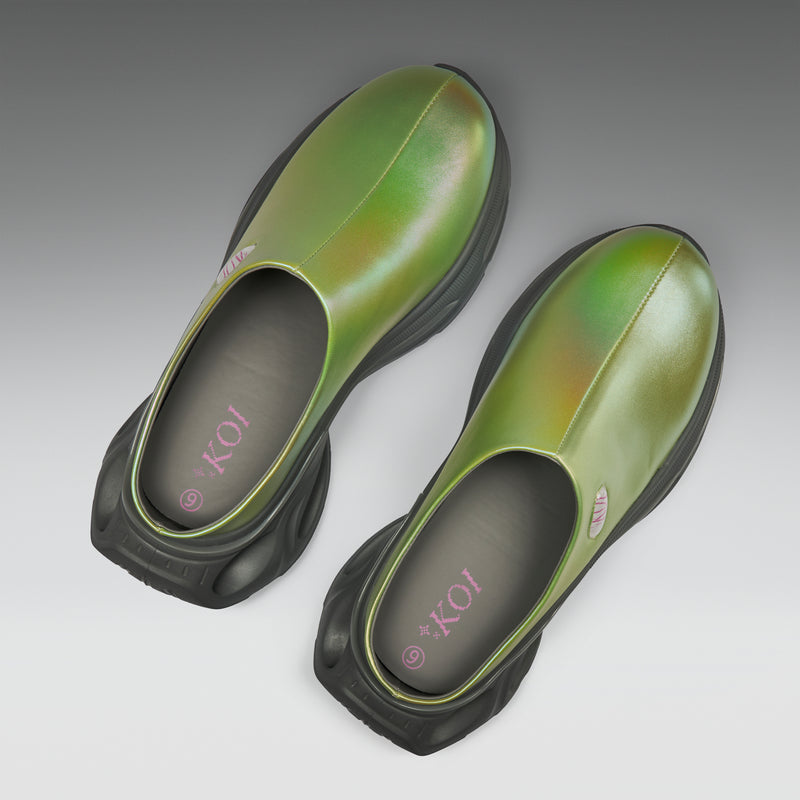 Pair of green and black shoes on a gray background