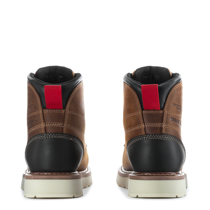 Brown men's work boots with red pull tabs at heel, black toe, white outsole
