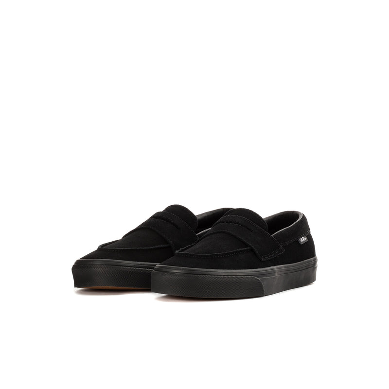 Kids' black Vans slip-on loafer, angled side view, padded collar, rubber sole