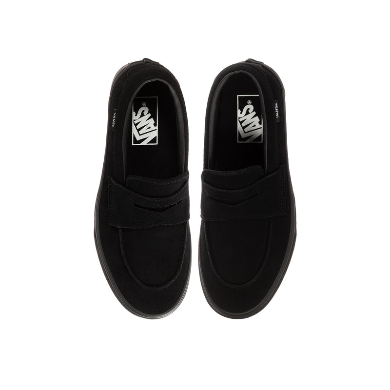 Kids' black Vans loafer, inside view showing Vans logo and slip-on opening