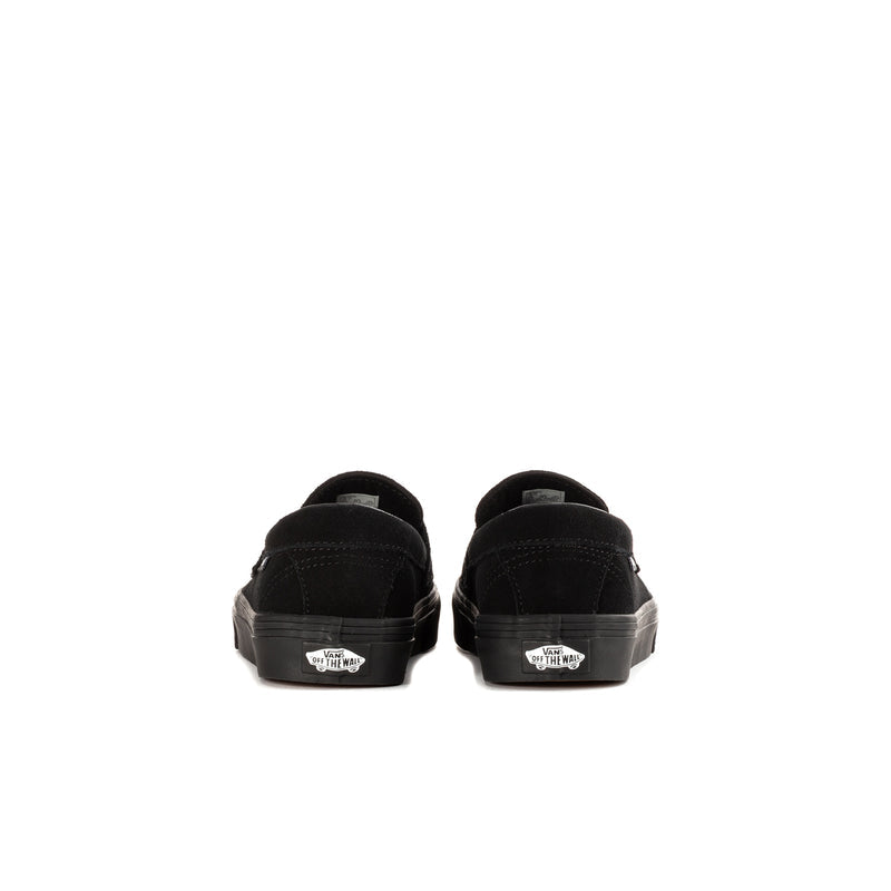 Kids' black Vans loafer heel view with rear seam and sidewall rubber sole