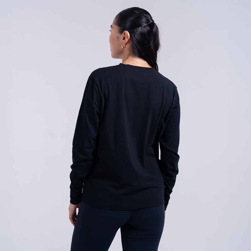 Women's black long-sleeve crewneck tee, back view on model