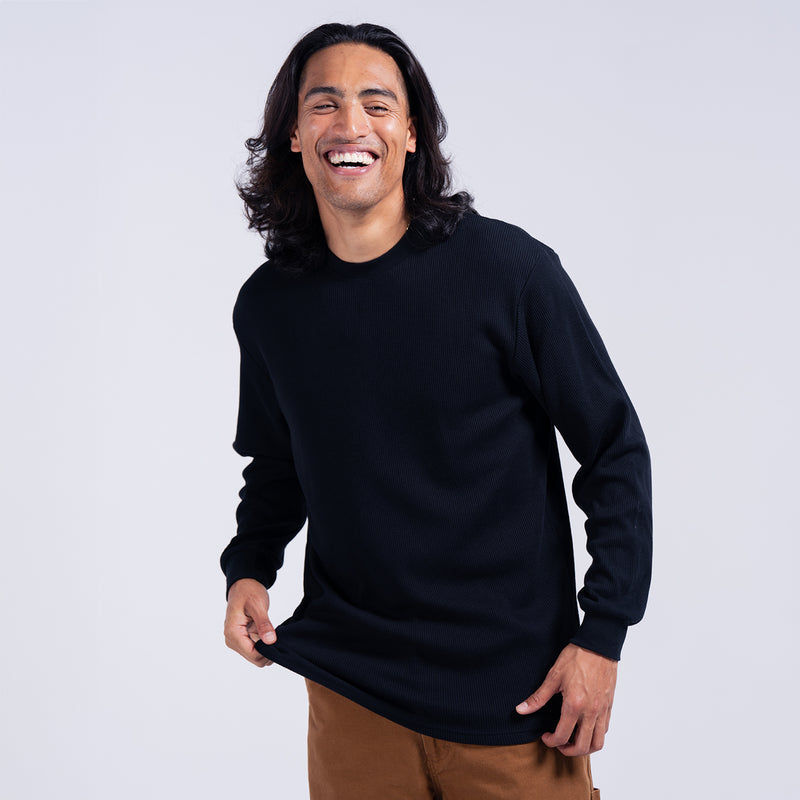 Black men's thermal long-sleeve crewneck shirt on model, ribbed cuffs