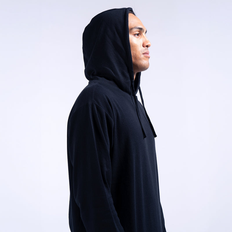 Black thermal pullover hoodie for men, profile view, drawstring hood, long sleeves.