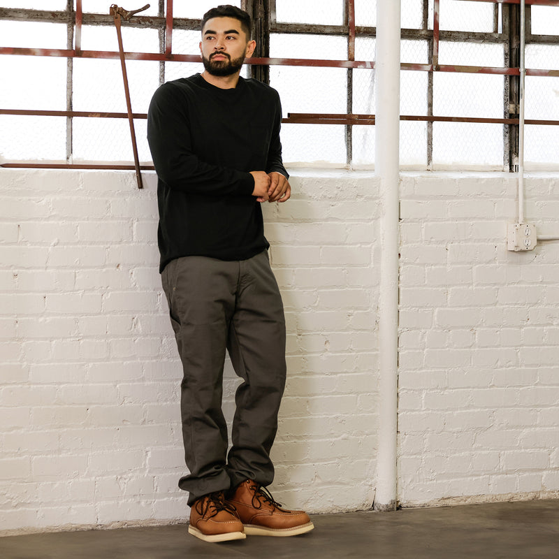 Men's black long-sleeve crewneck work shirt, full-body view