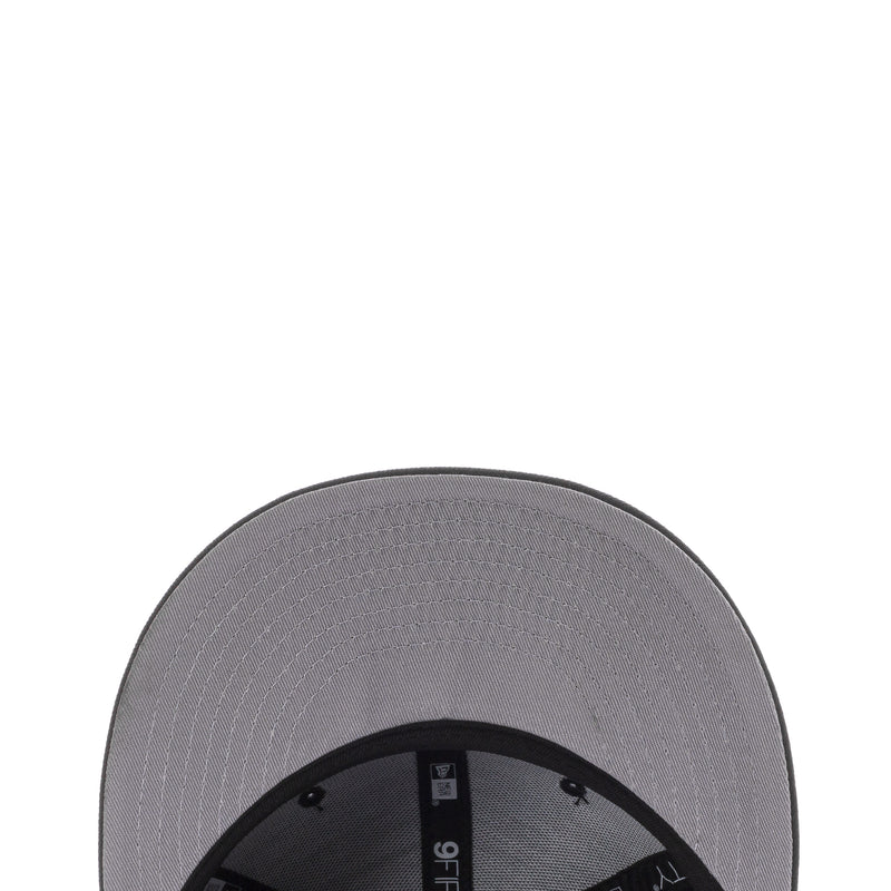 Baseball cap interior with gray panel and stitched label