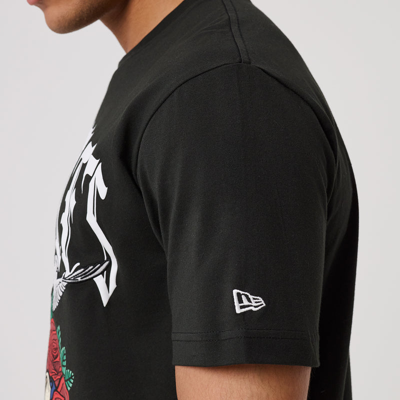 Black T-shirt sleeve with small New Era logo patch.