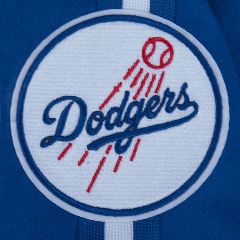 Close-up of Dodgers circular logo on blue youth tee with red and white details