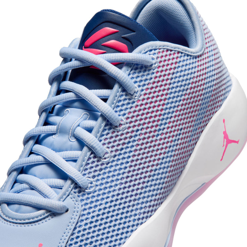 Men's blue sneaker upper close-up with pink Jumpman logo on heel and laces