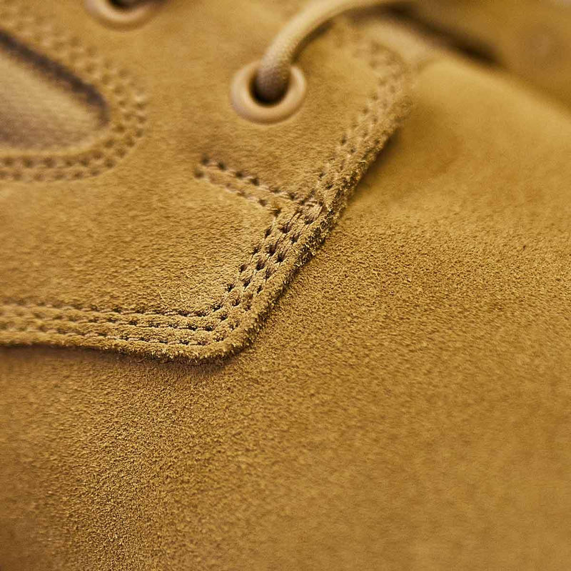 Close-up of GORUCK 8-inch coyote suede boot with reinforced stitching detail
