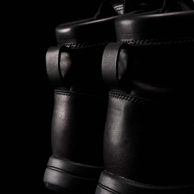 Close-up of black GORUCK rucking boots with rugged leather design and reinforced stitching.