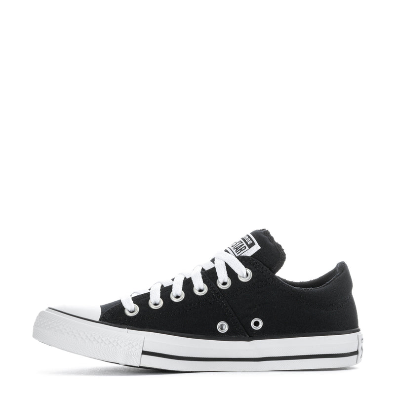 Black low-top canvas sneakers, side view with white laces and white rubber sole