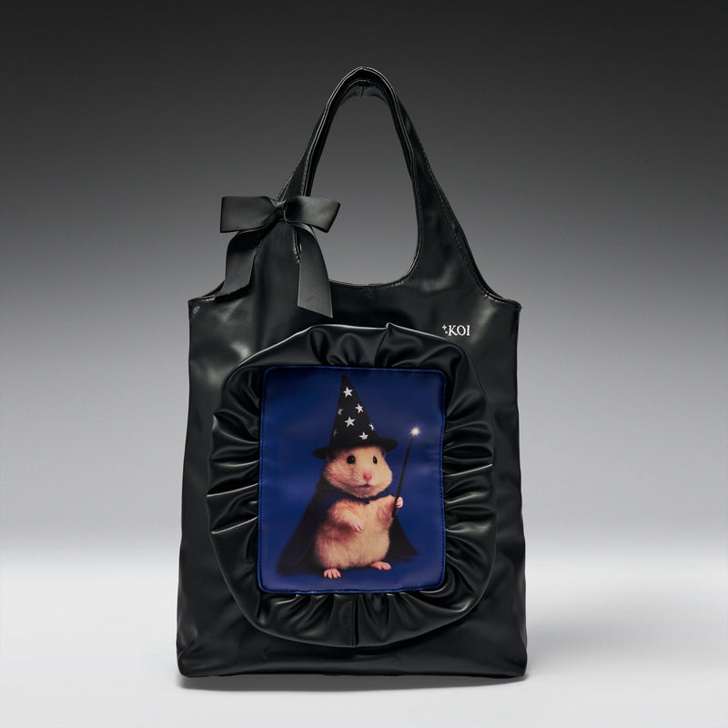 Black tote bag with a cartoon hamster in a wizard hat on a blue background