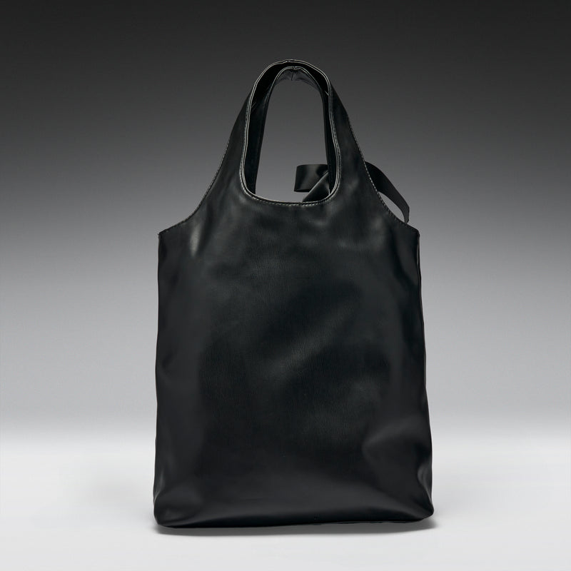 Black tote bag on a gradient gray background