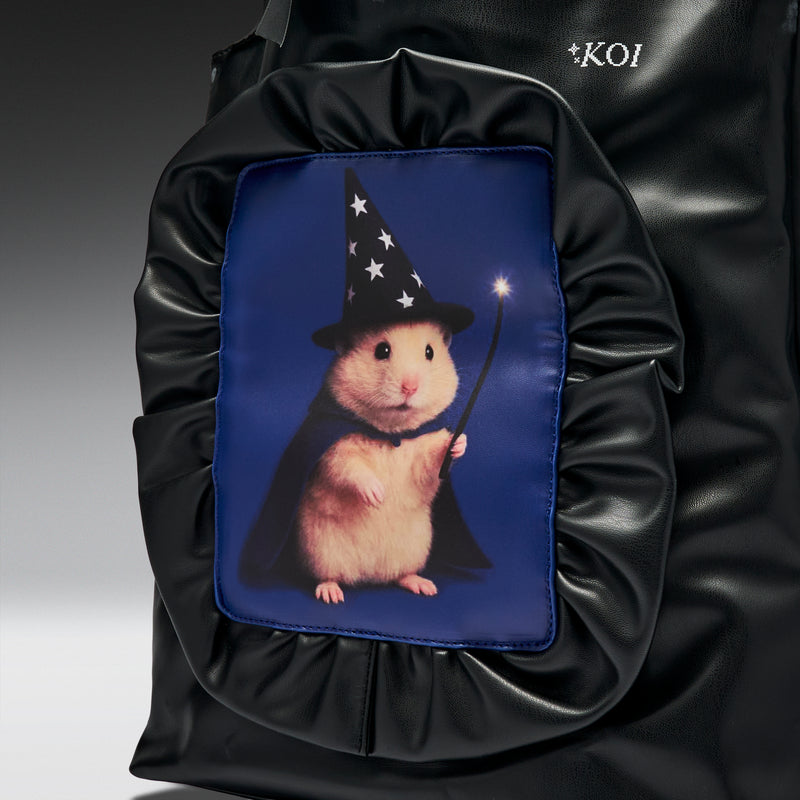 Black backpack with a pouch featuring a hamster in a wizard costume on a blue background.