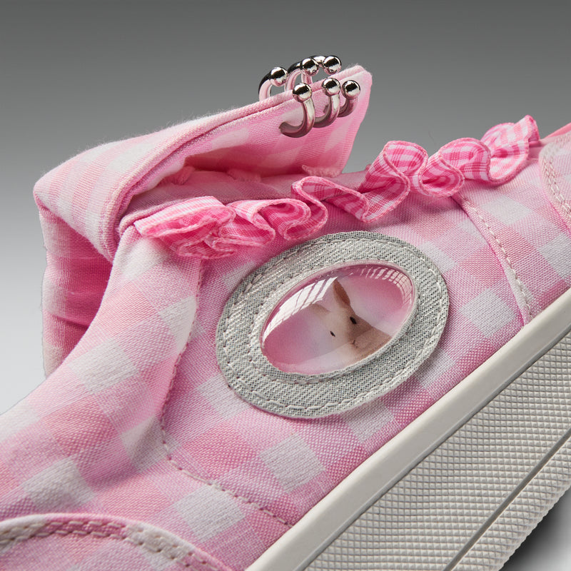 Pink checkered sneaker with a small white mouse peeking out of a hole in the sole.
