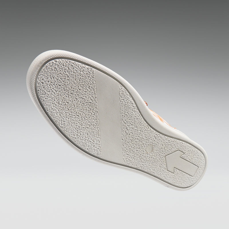 White shoe sole with brand logo on a gray background