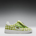 Green checkered sneaker with a white sole on a gray background