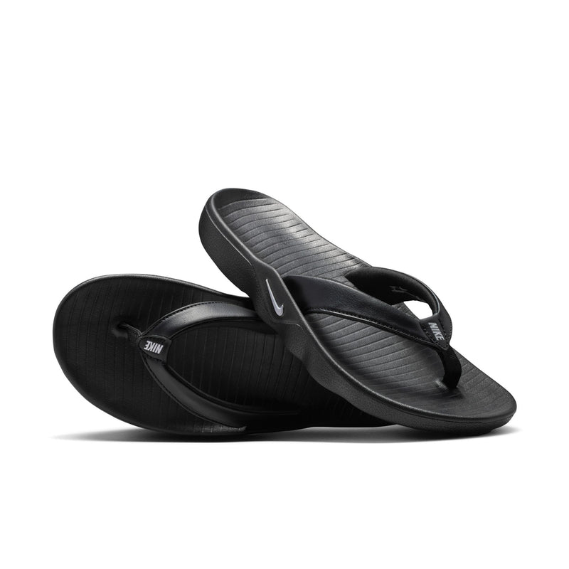 Women’s black thong sandals, side view with textured footbed