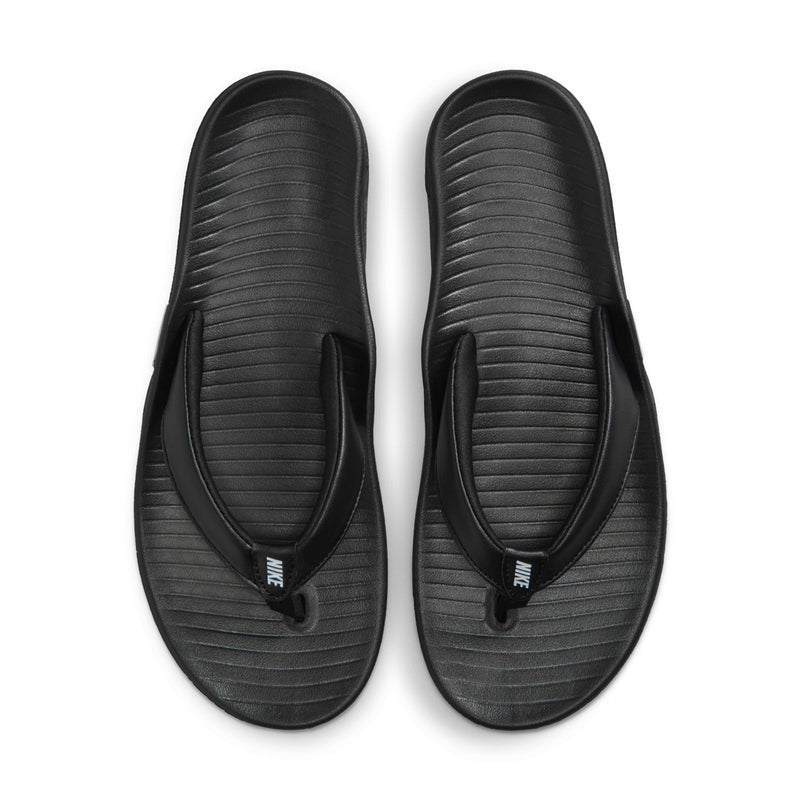 Pair of women’s black thong sandals with contoured, textured footbeds