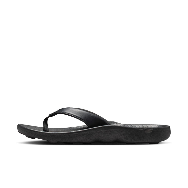 Women’s black thong sandals with open-toe thong strap and low profile sole