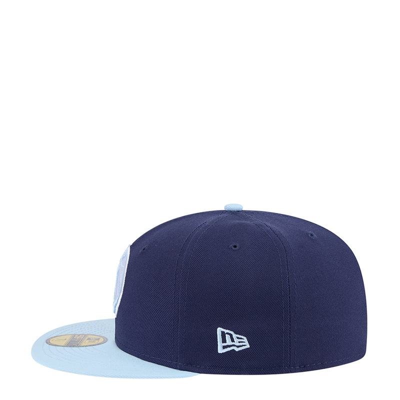 Navy baseball cap with light gray brim and white New Era flag logo
