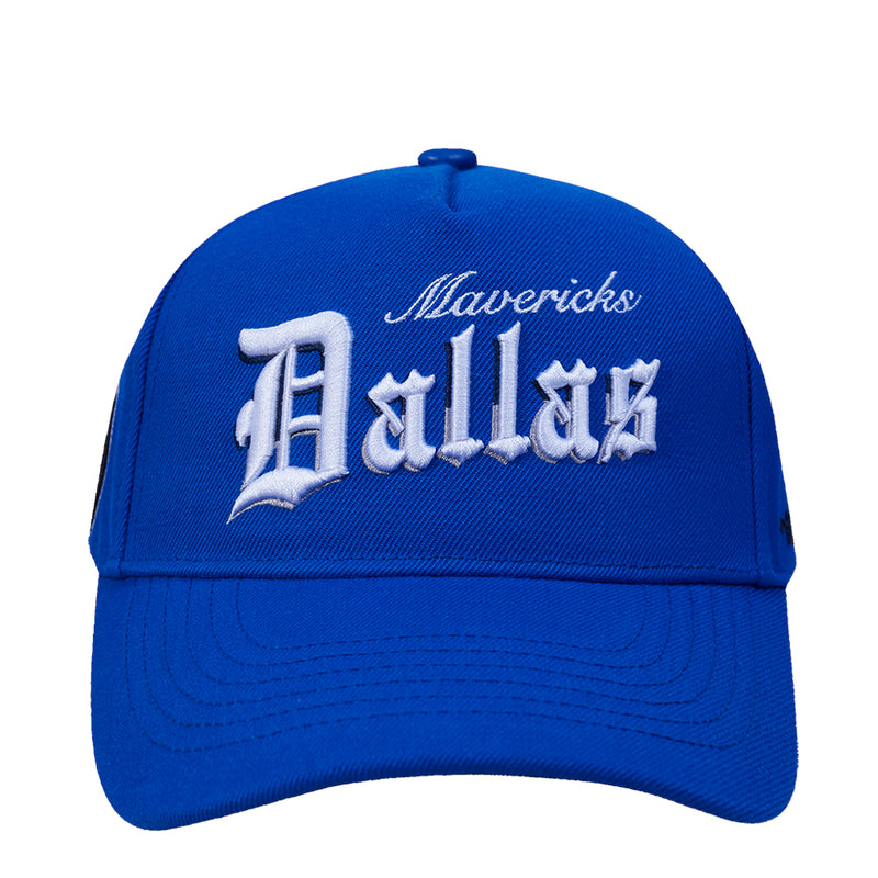 Blue snapback cap with embroidered “Mavericks” and “Dallas” on the front