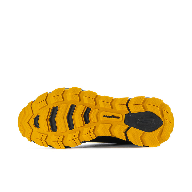 Yellow traction outsole with black center pods and Goodyear tread on men's sneaker
