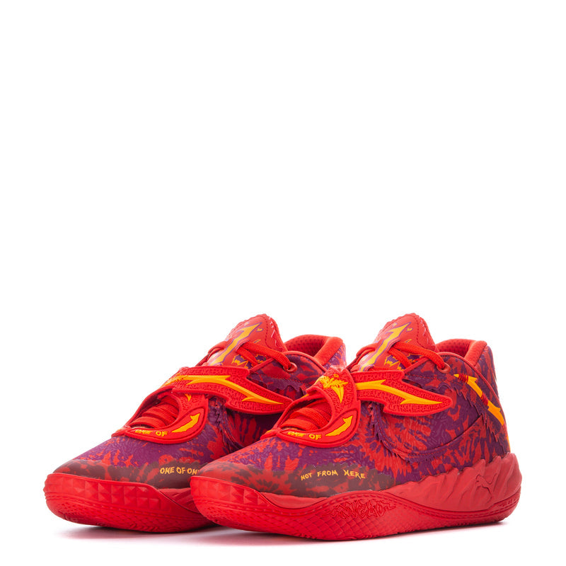 Pair of red low-top basketball sneakers with purple patterned upper and neon yellow accents.