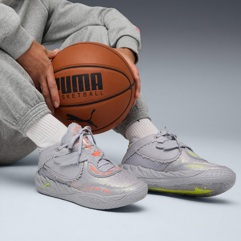 Gray men’s sneakers with lace-up front, neon detailing, and sport outsole texture