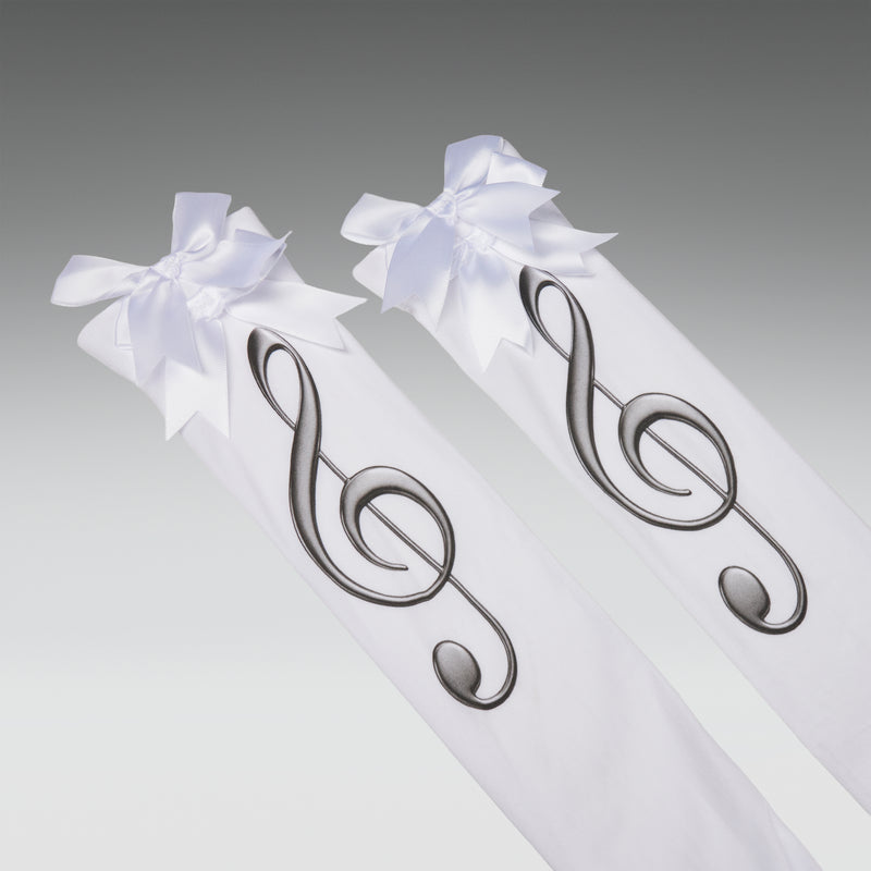 Two white ribbons tied with decorative silver music notes on a gray background