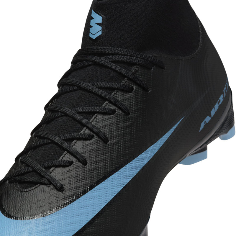 Close-up of men's black cleat upper with black laces and light blue trim