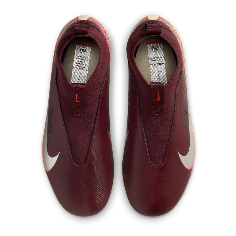 Youth burgundy indoor/outdoor soccer cleat with padded collar and white size label.