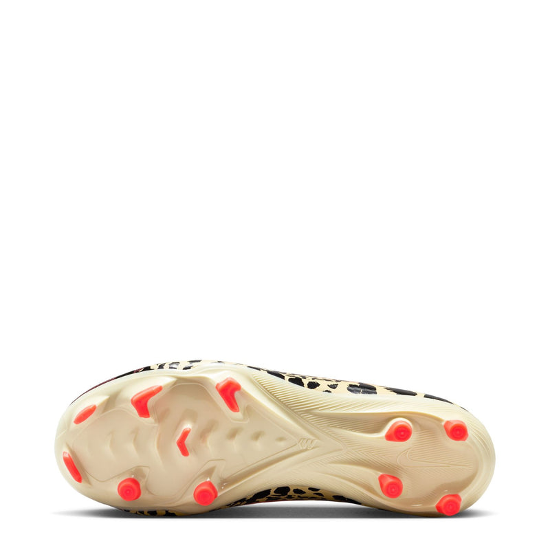 Youth soccer cleat outsole in light color with red round studs and camouflage heel.