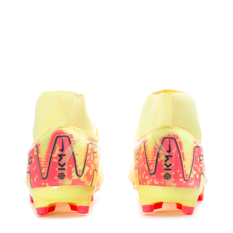 Back view of men's yellow soccer cleats with pink heel graphics and red studs