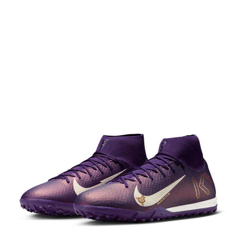 Pair of men's purple TF football boots with lace-up high tops and pale ivory swoosh