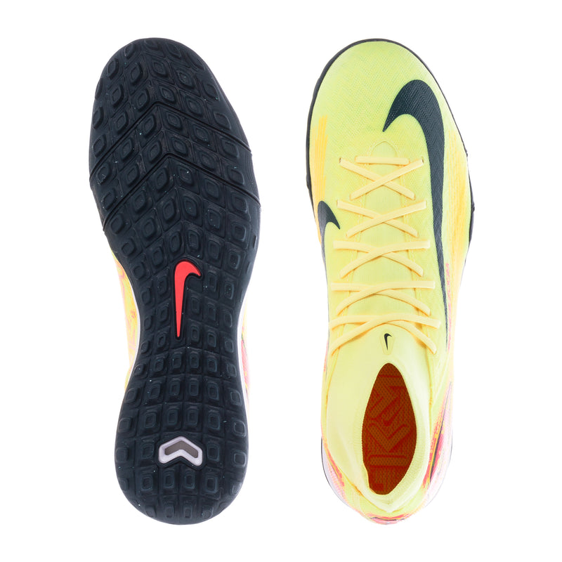 Turf soccer cleats outsole view, dark rubber tread with light yellow insole side