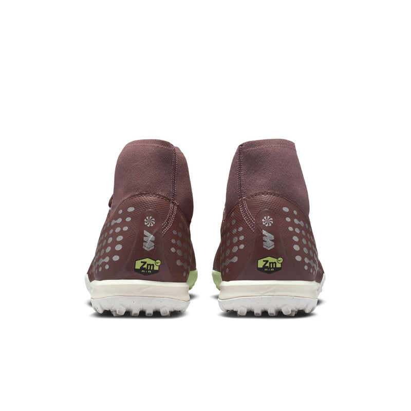 Back view of plum soccer cleats with dotted detailing and white traction outsole.
