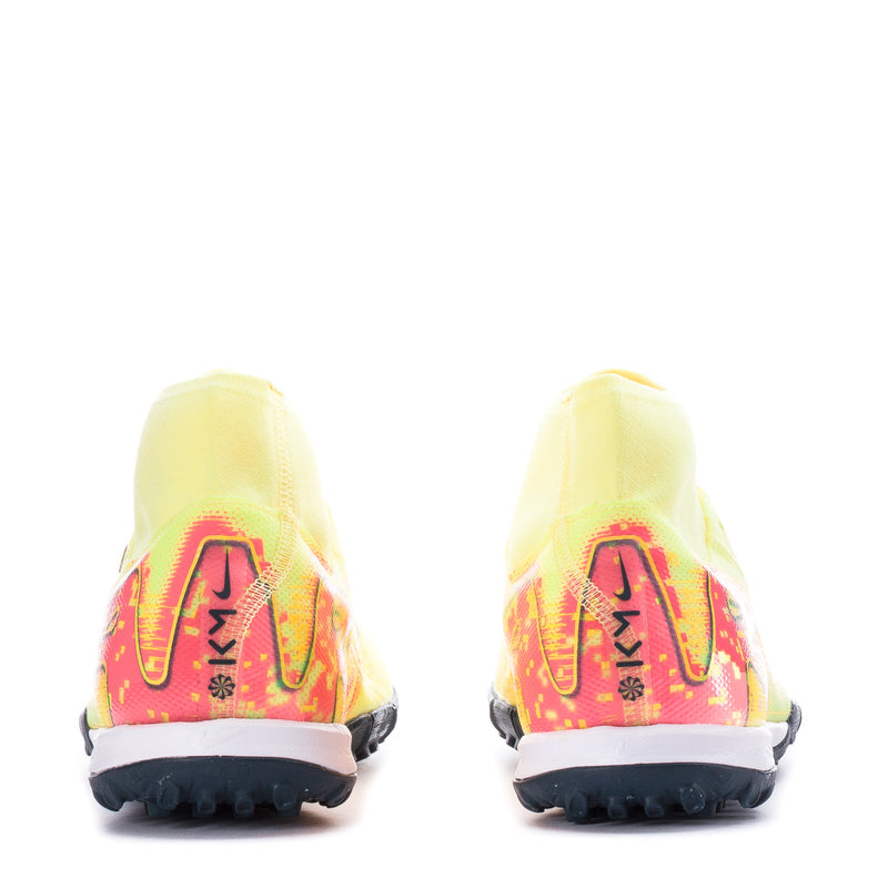 Back of men's turf soccer cleats, light yellow with red heel graphic and black outsole
