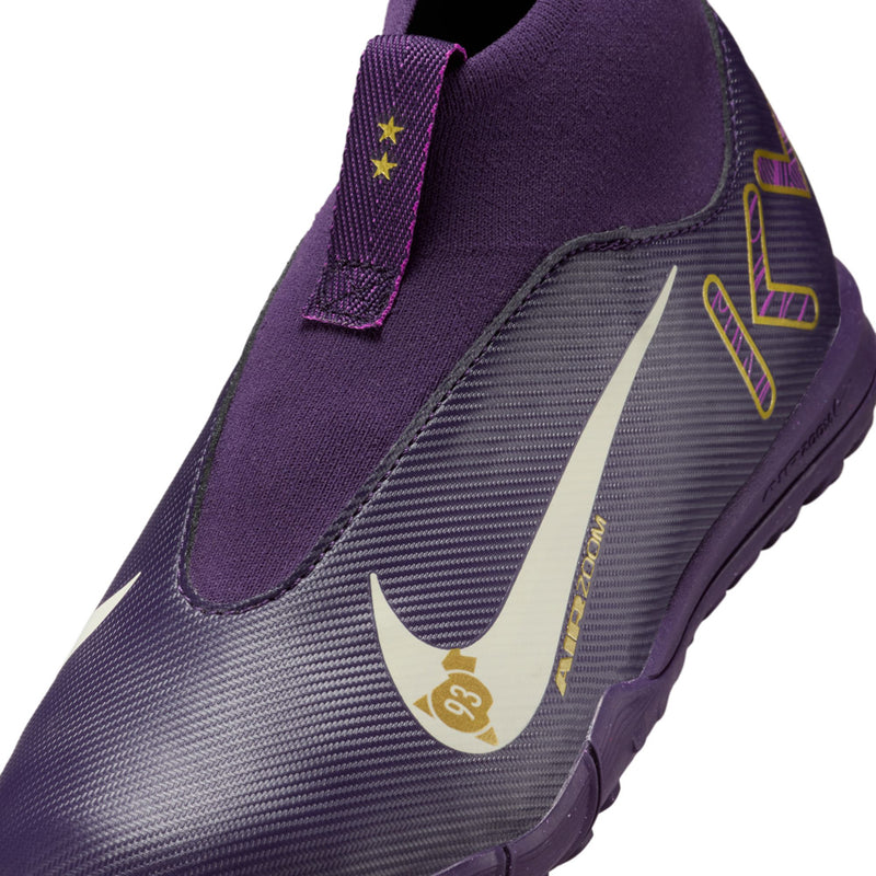 Youth purple TF soccer cleat, white Nike swoosh and gold accents, textured knit upper.