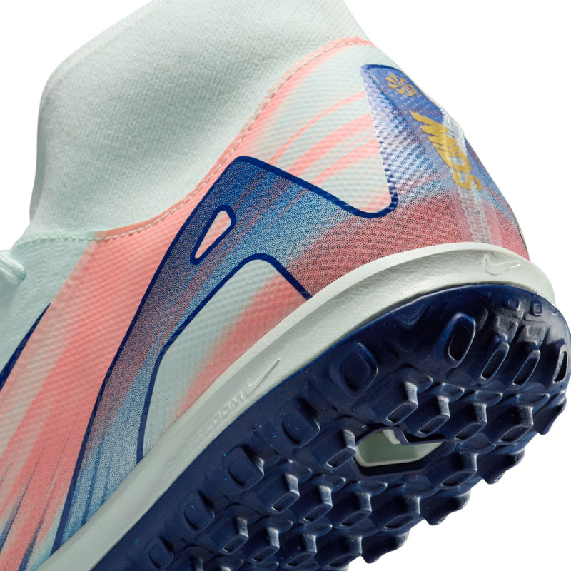 Men's turf cleat toe and rubber outsole close-up in mint with blue tread