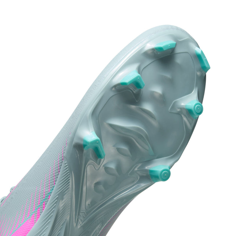 Bottom view of light blue men’s soccer cleat with teal molded studs
