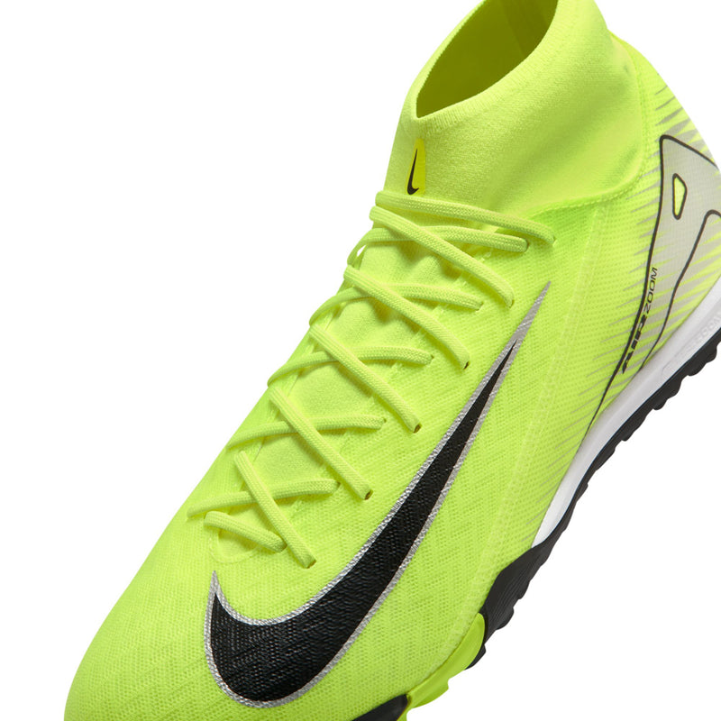Close-up neon green Nike Mercurial turf cleat with black Swoosh and lace rows